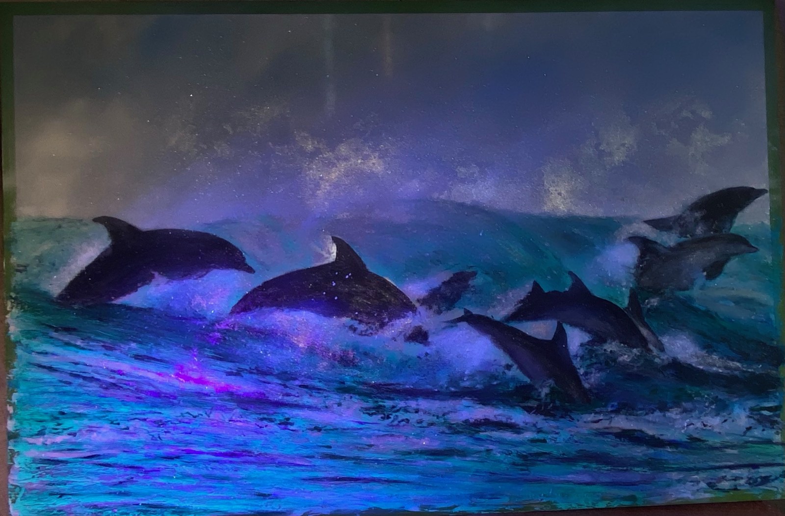 Dolphins leaping through turquoise waves beneath a luminous violet sky
