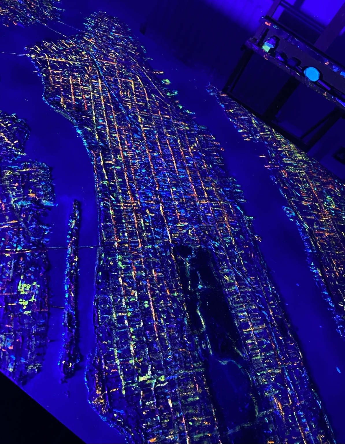 New York artwork glowing in violet UV light
