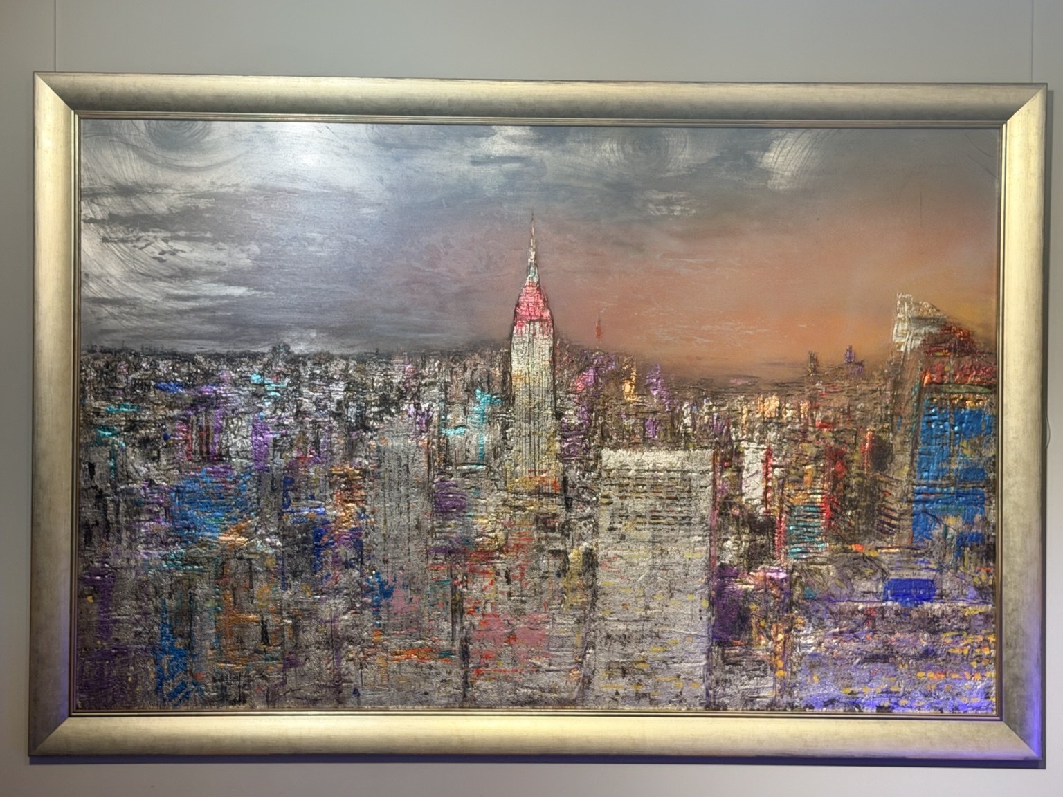 Framed mixed media Manhattan skyline with the Empire State Building and colourful illuminated buildings
